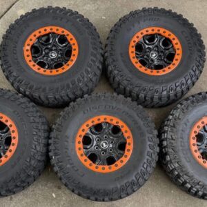 5 Sasquatch Wheels with Orange Ford Performance Beadlock rings on Cooper STT PRO 37x12.5 R17 tires